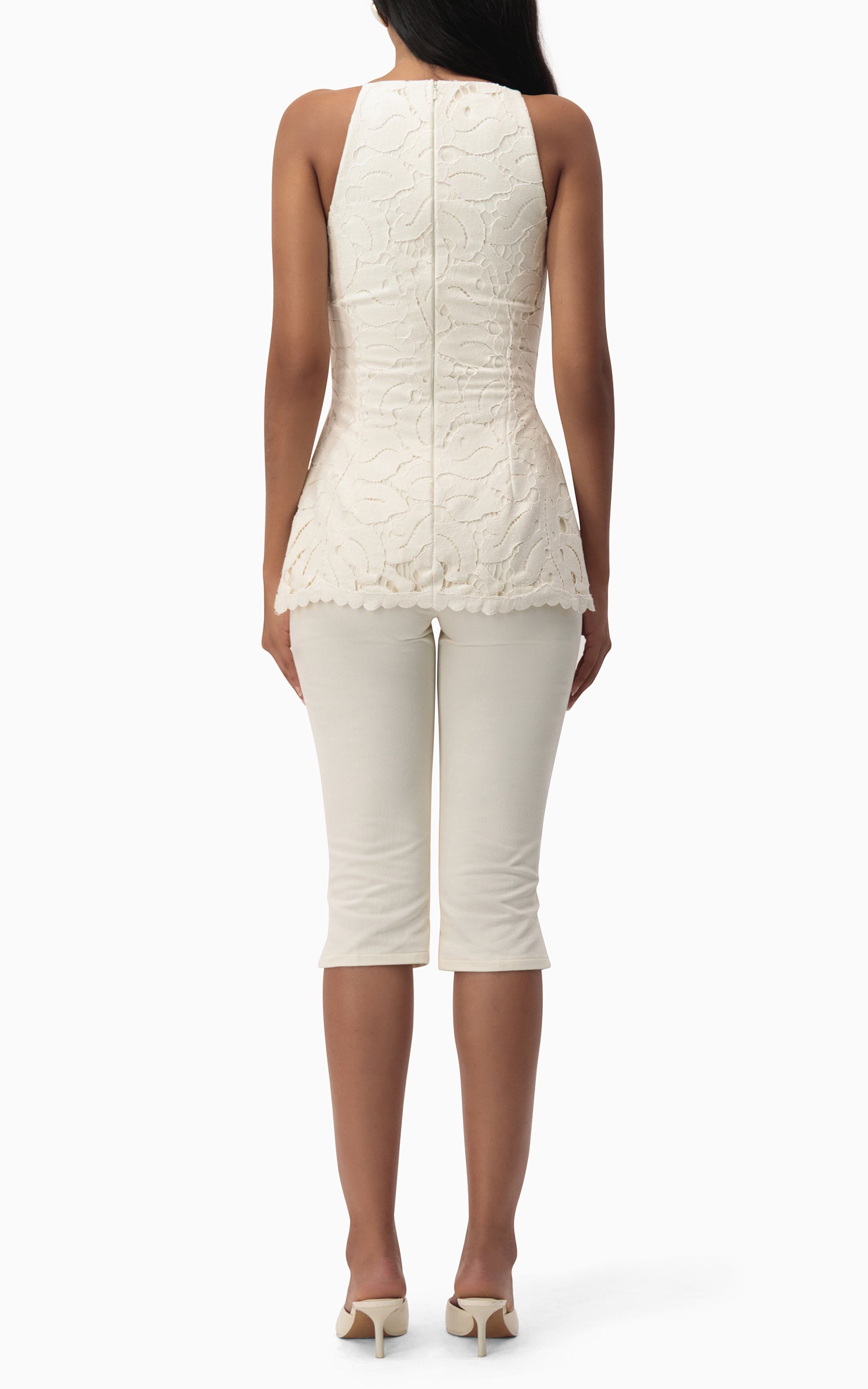 "Back view of Junie Capri off‑white denim capris with subtle hem slits"