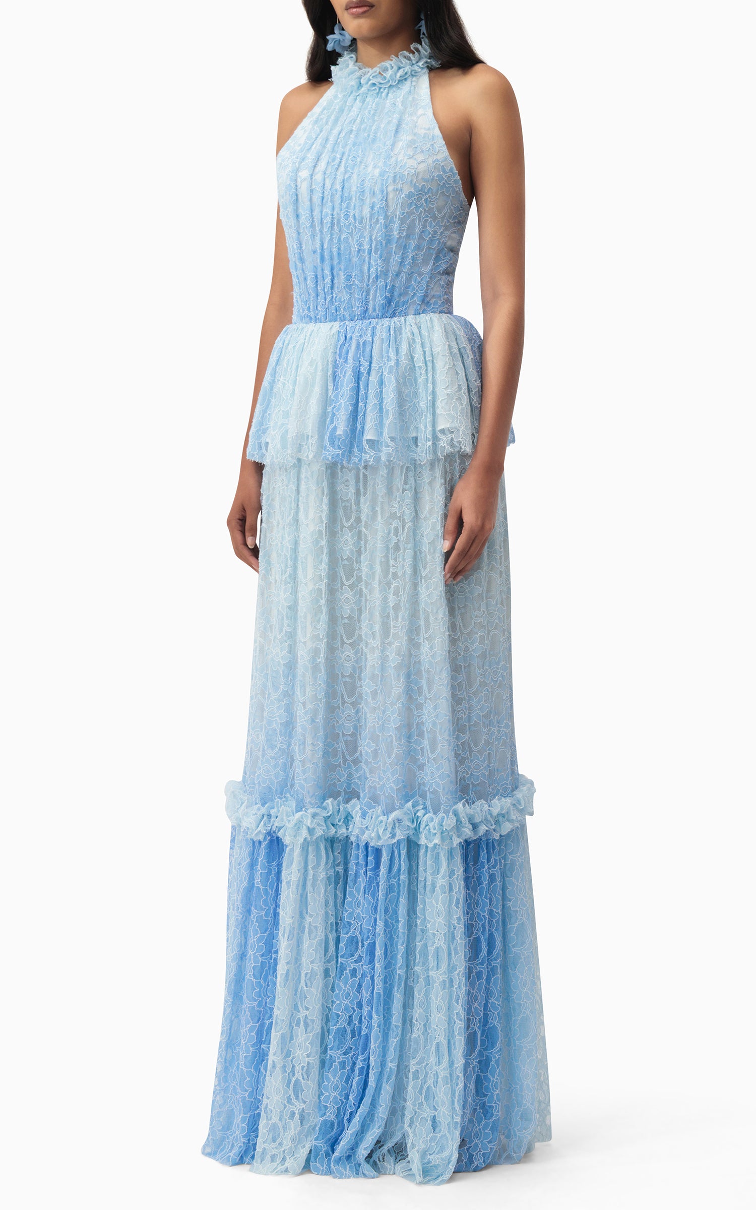 Model wearing halter blue lace dress with ruffles and peplum waist – perfect for beach weddings, summer events, and romantic getaways side view