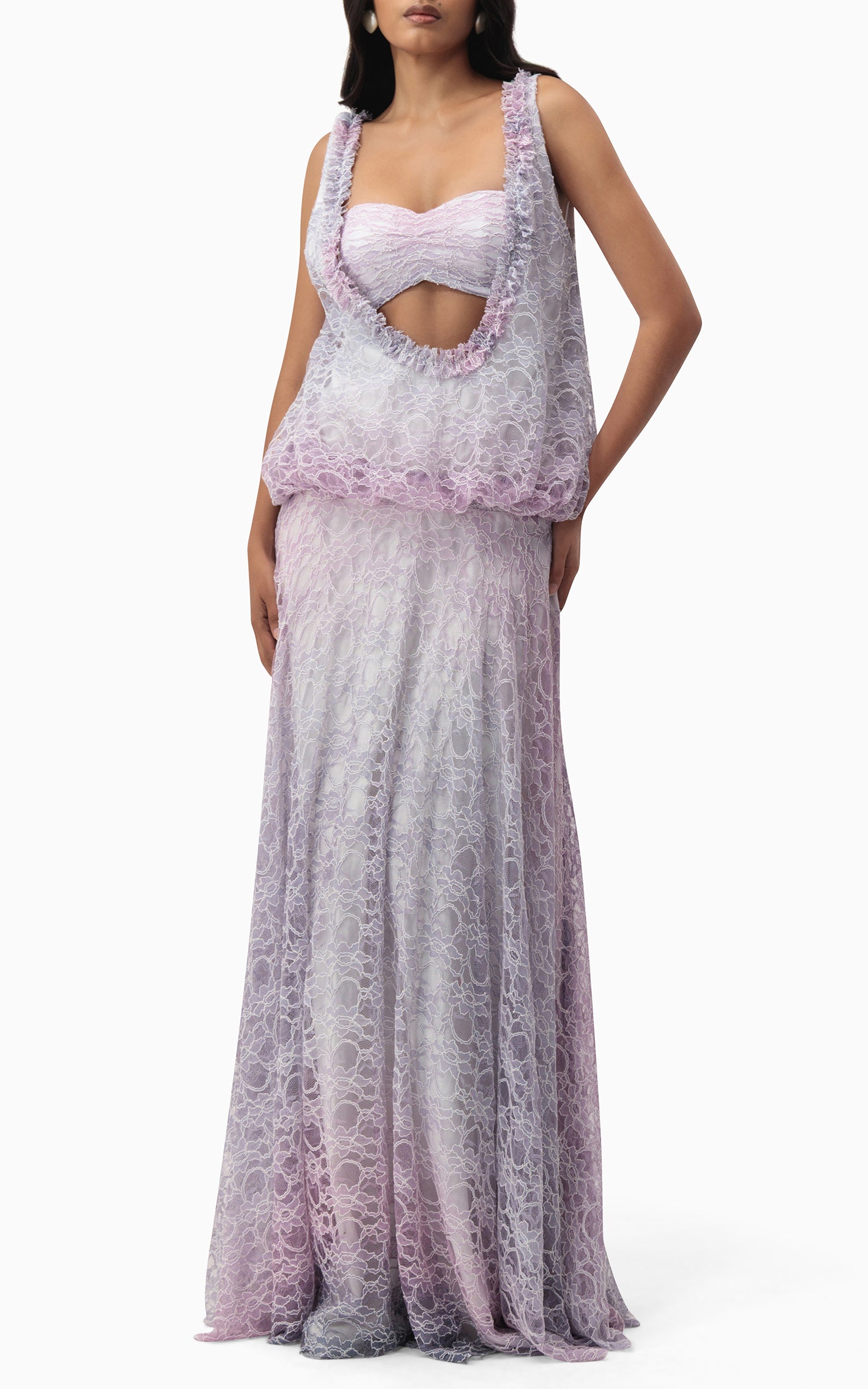 Side profile of The Gianna lilac lace gown showing ruched bandeau, draped layer, and flowing skirt