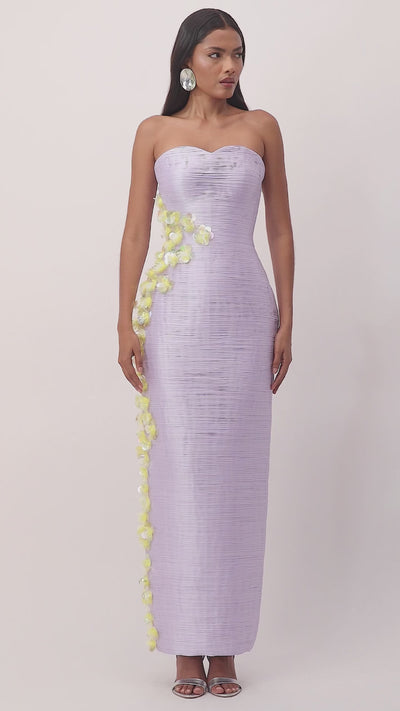 Model wearing lilac taffeta maxi dress with yellow floral detailing – perfect for evening events, weddings, or formal summer occasions.